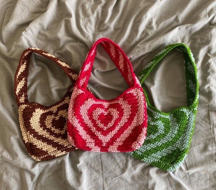 Three different colored crochet bags