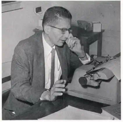 Chuck Croasdill typing on the typewriter