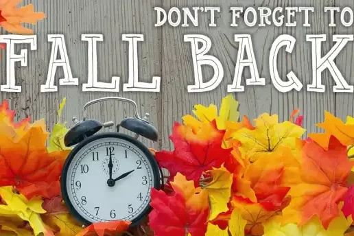 clock and fall colored leaves with text Dont Forget to Fall Back