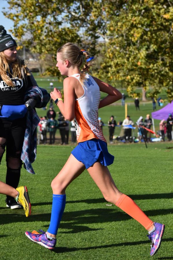 Freshman Opal Johnson racing at the State Cross Country Championships.