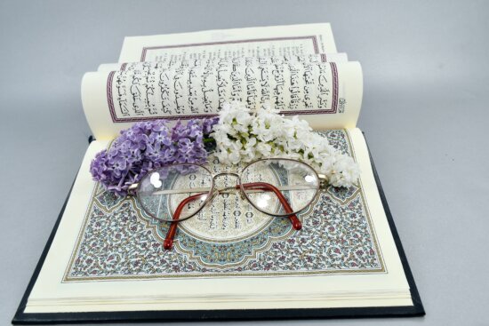 Book with Flowers and Glasses on the Pages