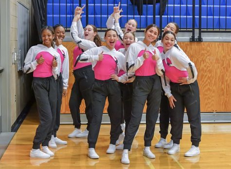 Lakes Dance Team in hip hop uniforms with L's up.